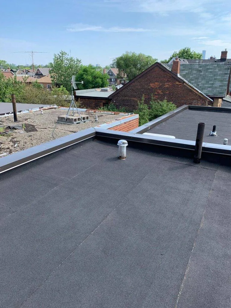 Roofers in Toronto — torch-on cap sheet flat roof