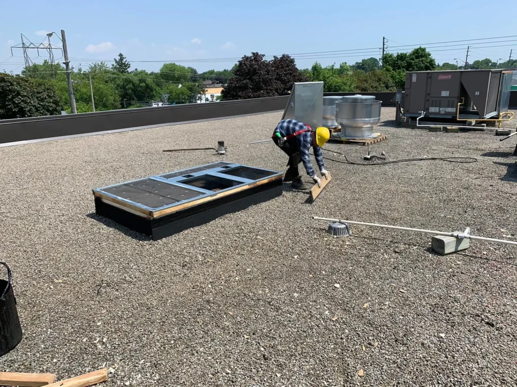 Tar and gravel flat roof repair completed by Quality Roofing Services in downtown Toronto