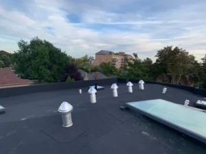 Torch on membrane roofing installation in Toronto showcasing durable and energy efficient flat roofing systems for commercial and residential buildings
